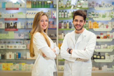 man and woman standing on the pharmacy