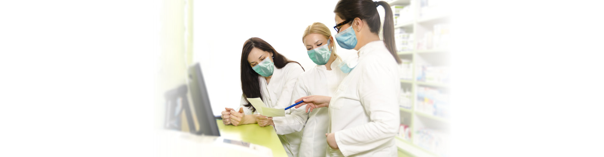 Happy positive pharmacists with surgical masks